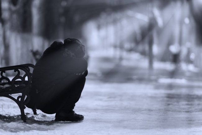 46432573 – depressed woman crying in the park in winter.